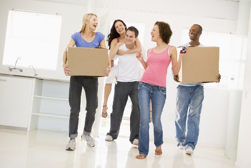 Removal van and moving team in a Stoke Newington residential street