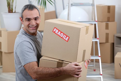 Removal van and moving boxes prepared for a Stoke Newington home move