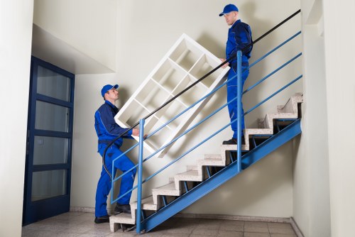 Flat removal with furniture carried through a narrow staircase in Stoke Newington