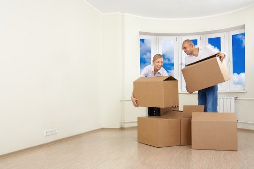 Moving team handling boxes and furniture in a Stoke Newington street